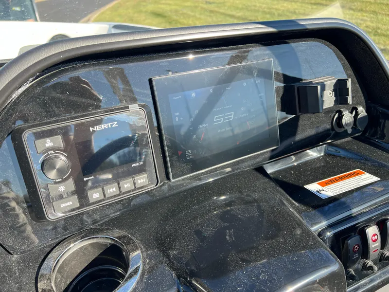 Slide: The Image of Dashboard of 2025 Yamaha Boats 195S with digital display and controls. - 13