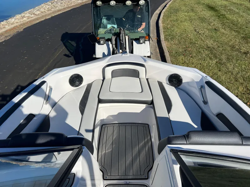 Slide: The Image of 2025 Yamaha Boats 195S interior, featuring sleek seating and modern design. - 14