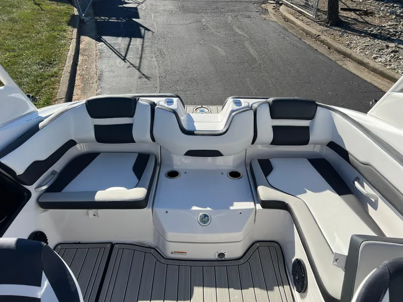 Slide: The Image of 2025 Yamaha Boats 195S interior seating area with modern design and cup holders. - 19