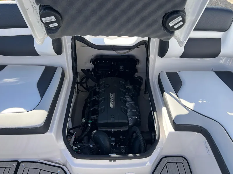 Slide: The Image of 2025 Yamaha Boats 195S engine compartment with open hatch, showcasing sleek interior design. - 20