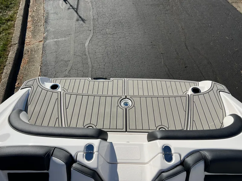 Slide: The Image of 2025 Yamaha Boats 195S swim platform with sleek design and cup holders. - 21