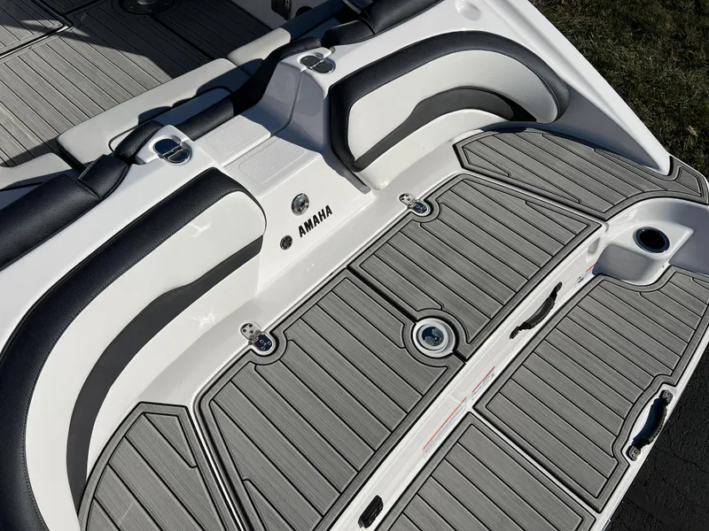 Slide: The Image of 2025 Yamaha Boats 195S deck with sleek gray and black seating. - 7