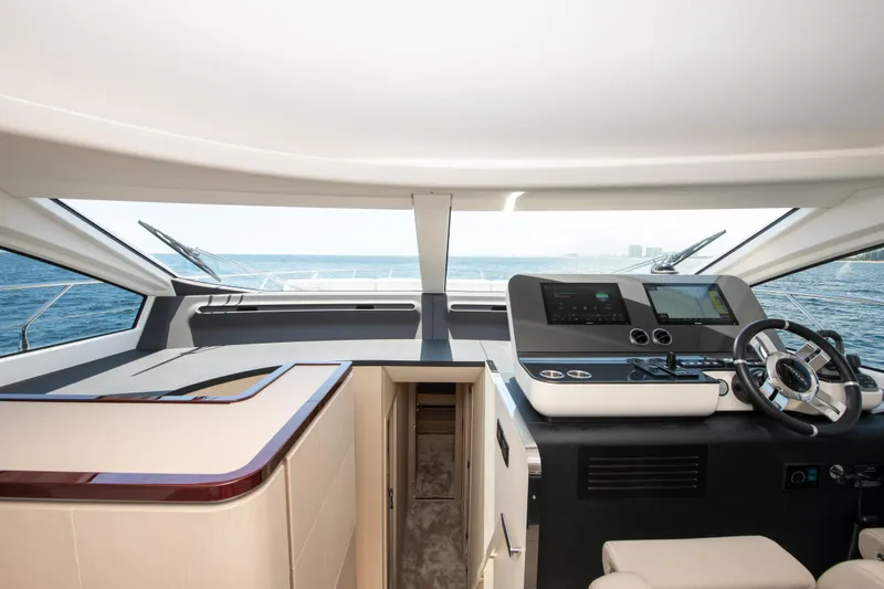 Slide: The Image of Interior view of 2023 Azimut Fly 68 yacht cockpit with ocean backdrop. - 16