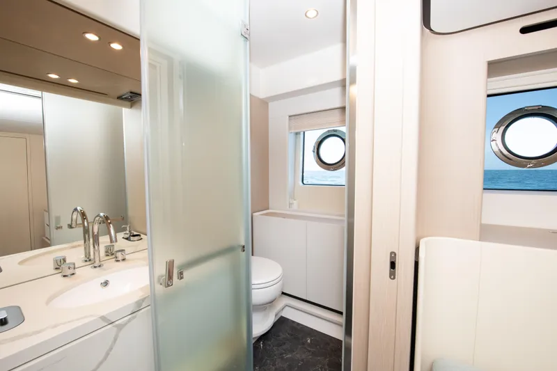 Slide: The Image of Luxurious bathroom on 2023 Azimut Fly 68 yacht with modern fixtures and ocean view. - 20