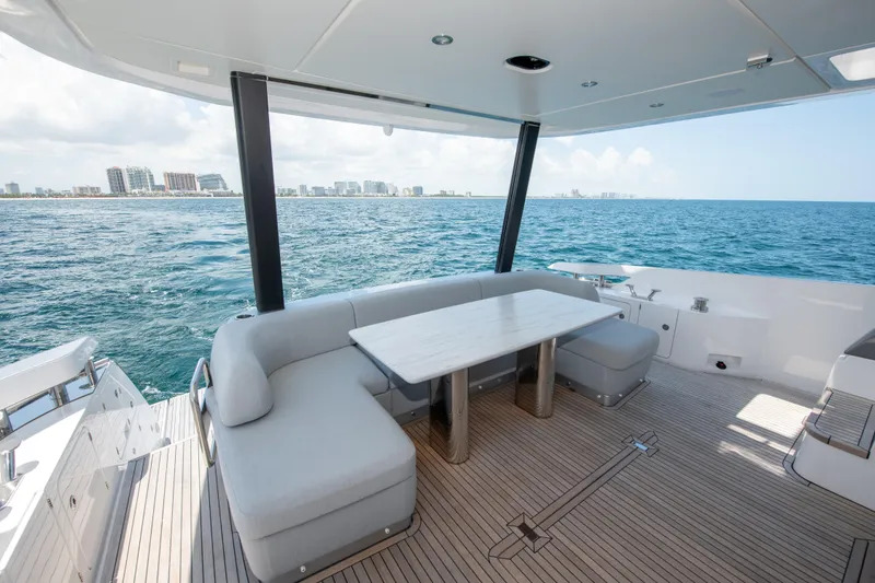 Slide: The Image of Luxurious 2023 Azimut Fly 68 yacht deck with ocean view and elegant seating area. - 28