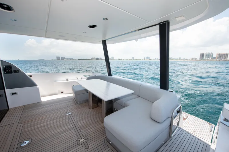 Slide: The Image of Luxurious 2023 Azimut Fly 68 yacht deck with seating and ocean view. - 29