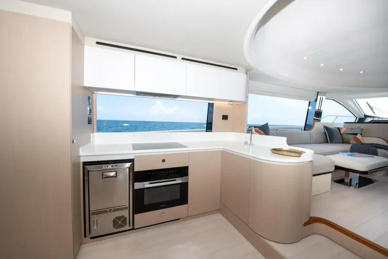 Slide: The Image of Luxurious interior of 2023 Azimut Fly 68 yacht with modern kitchen and ocean view. - 3