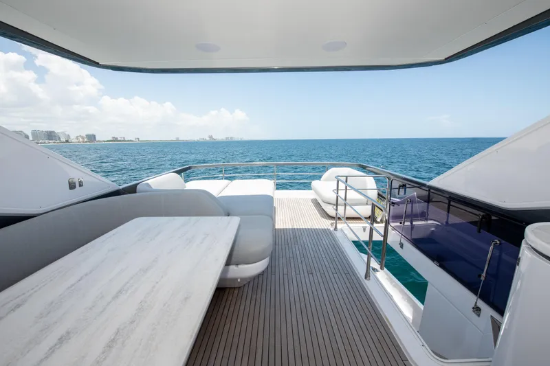 Slide: The Image of Luxurious 2023 Azimut Fly 68 yacht deck with ocean view and elegant seating. - 31