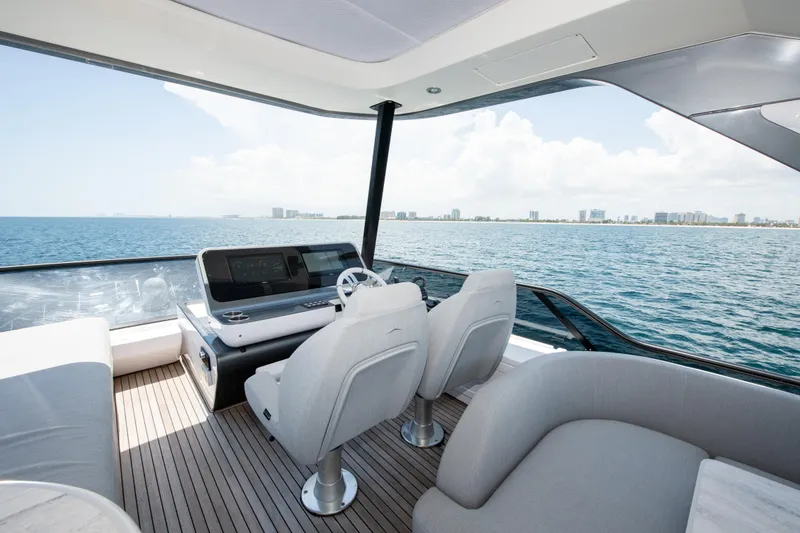 Slide: The Image of Luxurious 2023 Azimut Fly 68 yacht interior with ocean view and modern helm. - 37