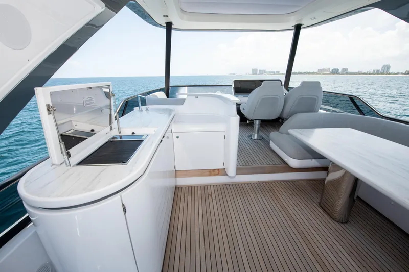 Slide: The Image of Luxurious 2023 Azimut Fly 68 yacht interior with modern seating and ocean view. - 38
