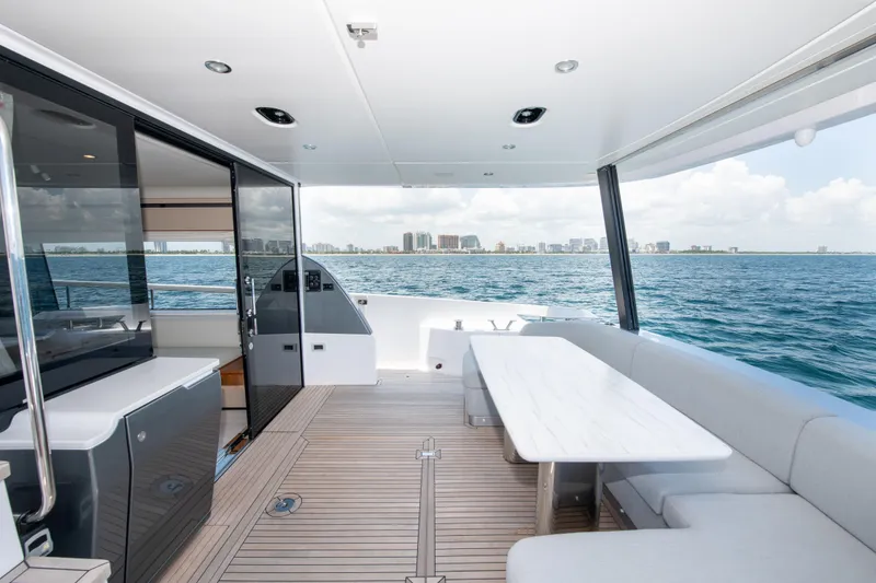 Slide: The Image of Azimut Fly 68 yacht deck, 2023 model, with ocean view and modern seating area. - 4