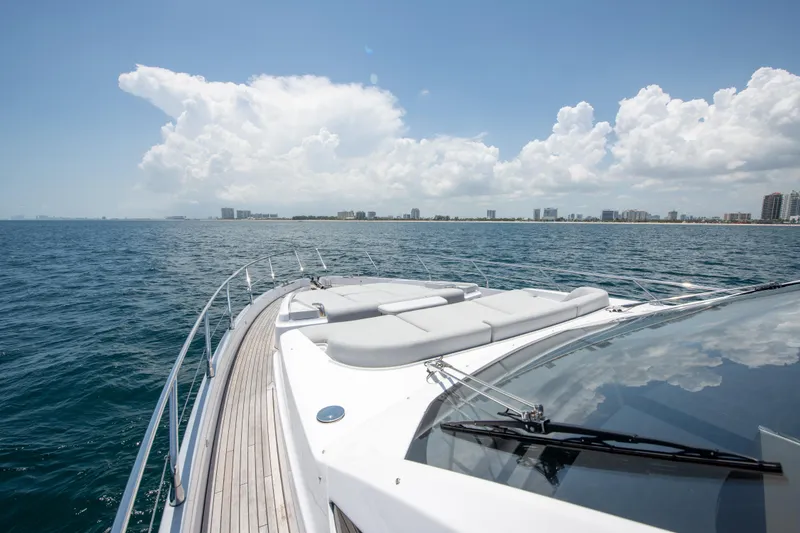 Slide: The Image of 2023 Azimut Fly 68 yacht cruising on open sea under clear skies. - 41