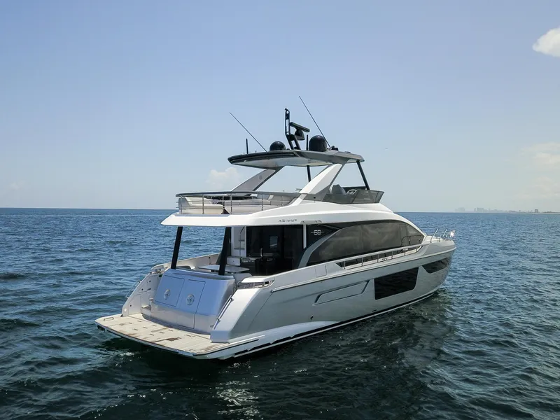 Slide: The Image of 2023 Azimut Fly 68 yacht cruising on open water. - 7