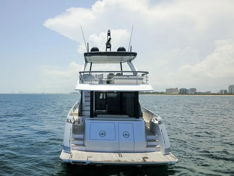 Slide: The Image of 2023 Azimut Fly 68 yacht on open water, rear view. - 9