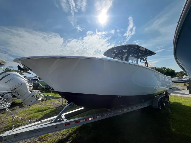 Slide: The Image of Wooden cabinet detail inside 2025 Sportsman Open 302 Center Console boat. - 18