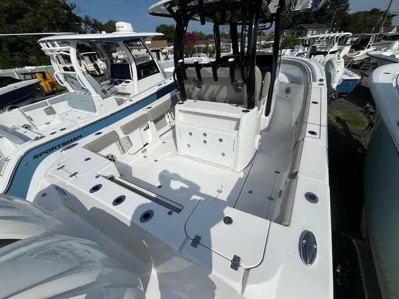 Slide: The Image of 2025 Sportsman Open 302 Center Console seat with storage compartment open. - 21