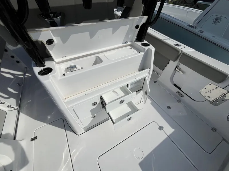 Slide: The Image of 2025 Sportsman Open 302 Center Console boat interior with cushioned seating. - 22