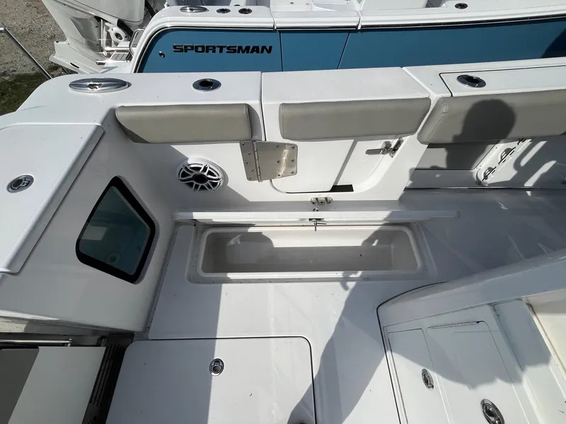 Slide: The Image of 2025 Sportsman Open 302 Center Console boat interior with seating and storage compartments. - 24