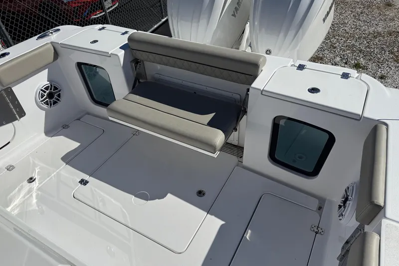 Slide: The Image of 2025 Sportsman Open 302 Center Console boat interior with seating and storage compartments. - 6