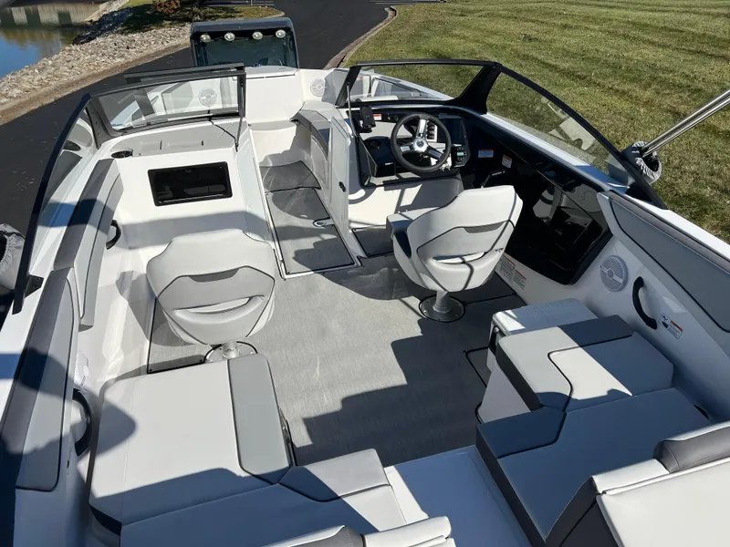 Slide: The Image of 2025 Yamaha Boats SX220 interior with modern seating and sleek design. - 10