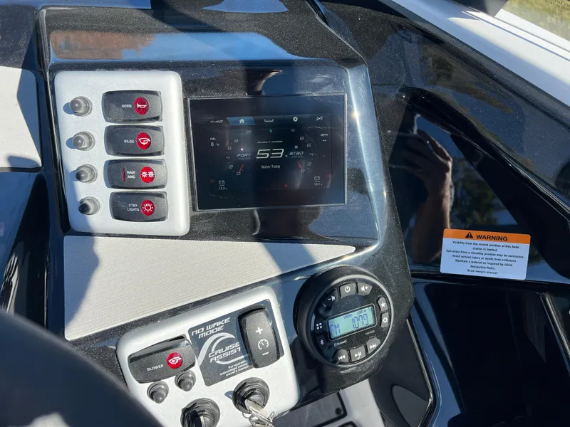Slide: The Image of Dashboard of 2025 Yamaha Boats SX220, featuring modern controls and digital display. - 14