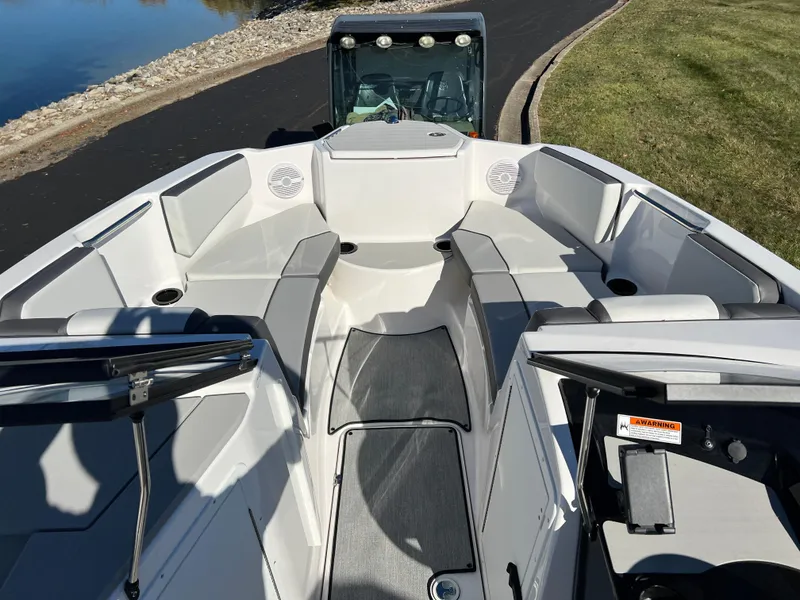 Slide: The Image of 2025 Yamaha Boats SX220 interior, featuring spacious seating and modern design. - 15