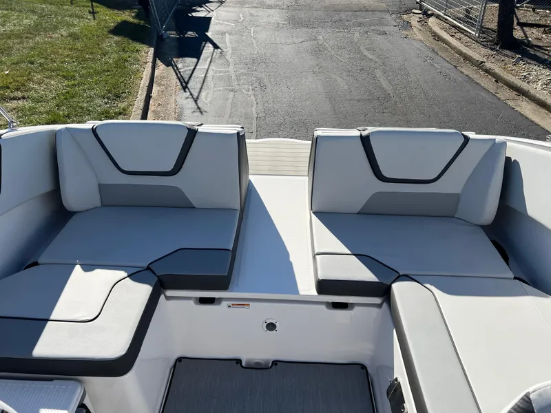 Slide: The Image of 2025 Yamaha Boats SX220 interior seating with modern design and comfortable cushions. - 20