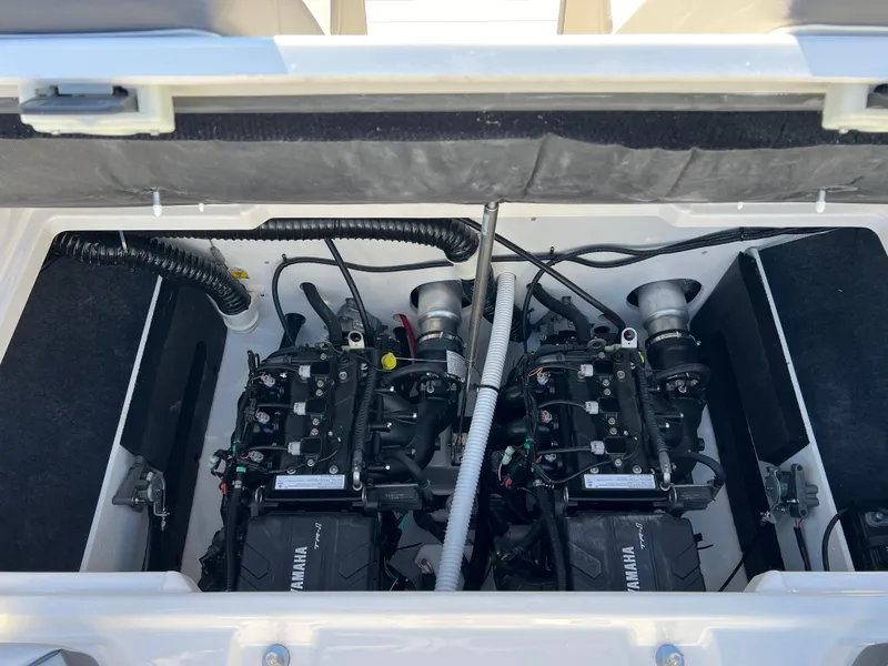 Slide: The Image of 2025 Yamaha SX220 boat engine compartment with dual engines. - 21