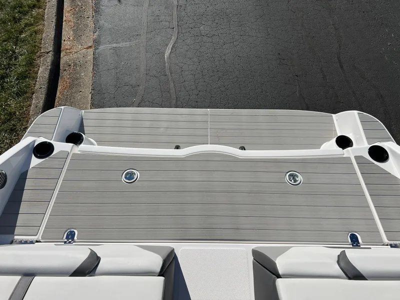 Slide: The Image of 2025 Yamaha Boats SX220 swim platform with sleek design and cup holders. - 22