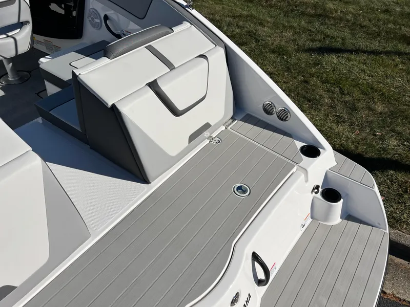 Slide: The Image of 2025 Yamaha Boats SX220 interior with seating and cup holders. - 9