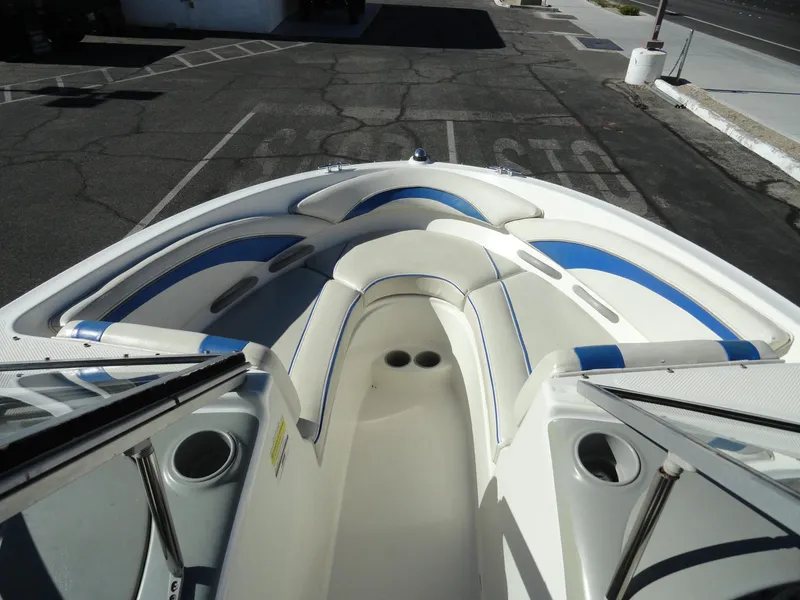 Slide: The Image of 2006 Bayliner 195 Bowrider boat interior with blue and white seating. - 12