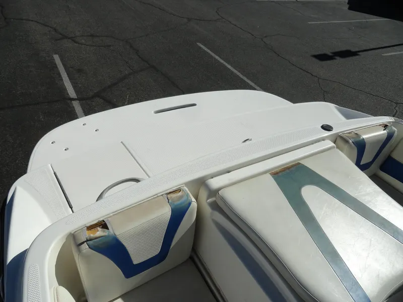 Slide: The Image of 2006 Bayliner 195 Bowrider boat interior with white and blue seating. - 15