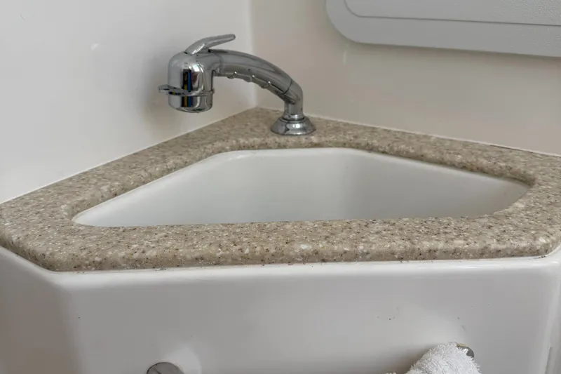 Slide: The Image of Corner sink with chrome faucet in 2017 Edgewater 280CC boat. - 13