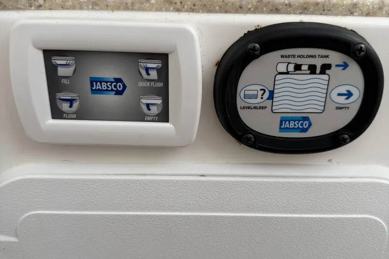 Slide: The Image of Edgewater 280CC 2017 boat control panel with Jabsco waste management system. - 14