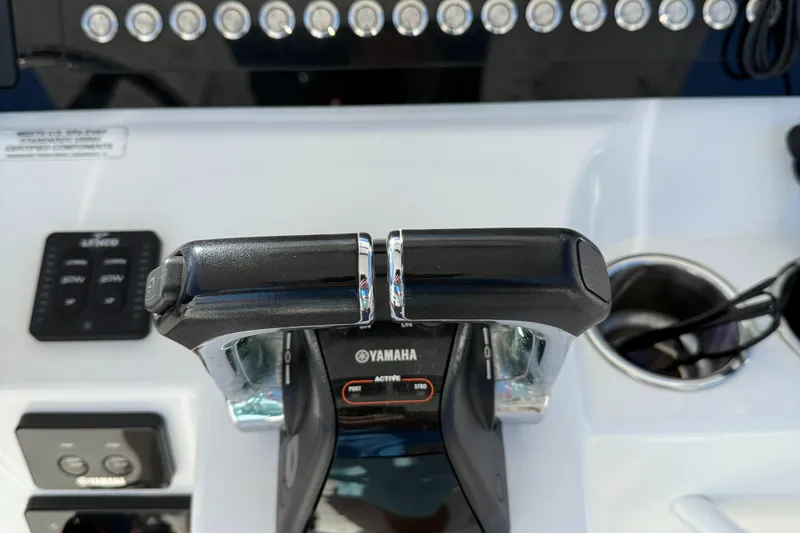 Slide: The Image of Edgewater 280CC 2017 boat controls with Yamaha throttle and dashboard. - 16