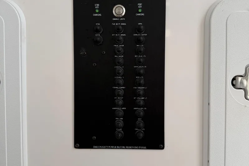 Slide: The Image of Control panel of a 2017 Edgewater 280CC boat with various switches and indicators. - 18