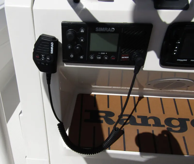 Slide: The Image of Simrad marine radio on 2022 Ranger 2600 Bay boat dashboard. - 28