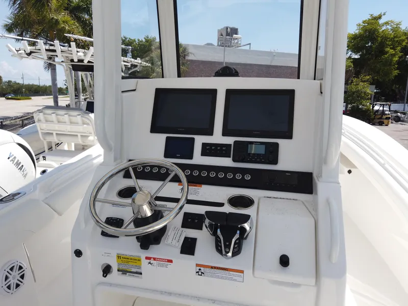 Slide: The Image of 2025 Regulator 25 boat console with steering wheel and electronic displays. - 13