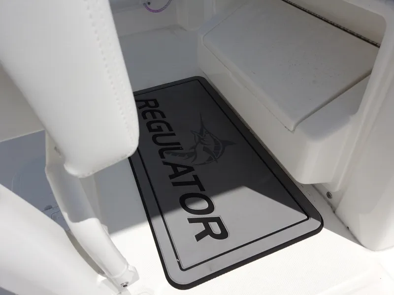 Slide: The Image of 2025 Regulator 25 boat interior with branded floor mat. - 9