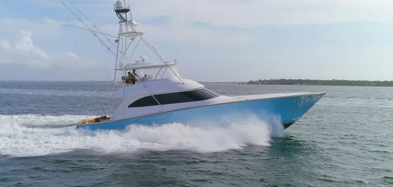 Slide: The Image of 2015 Viking 70 Convertible yacht cruising on open water. - 23
