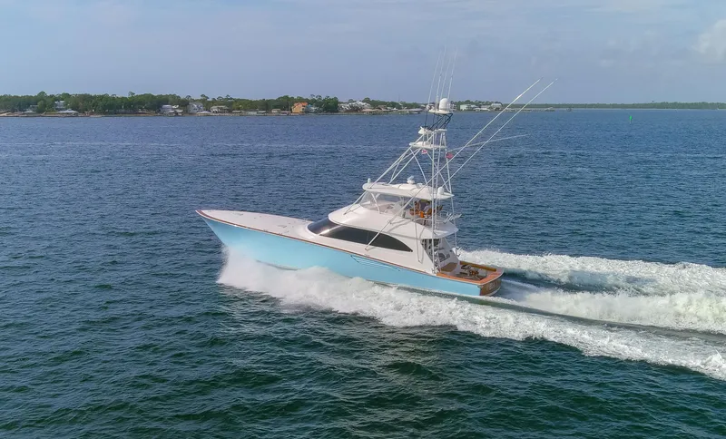 Slide: The Image of 2015 Viking 70 Convertible yacht cruising on open water. - 27