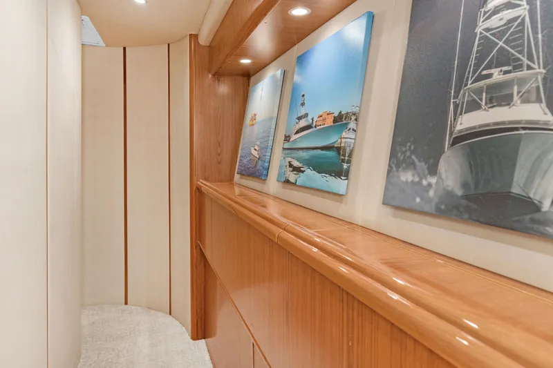 Slide: The Image of Interior hallway of 2015 Viking 70 Convertible yacht with nautical artwork. - 33