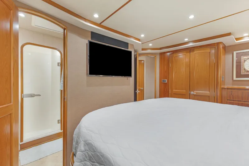 Slide: The Image of Luxurious interior of 2015 Viking 70 Convertible yacht with wood paneling and modern amenities. - 35