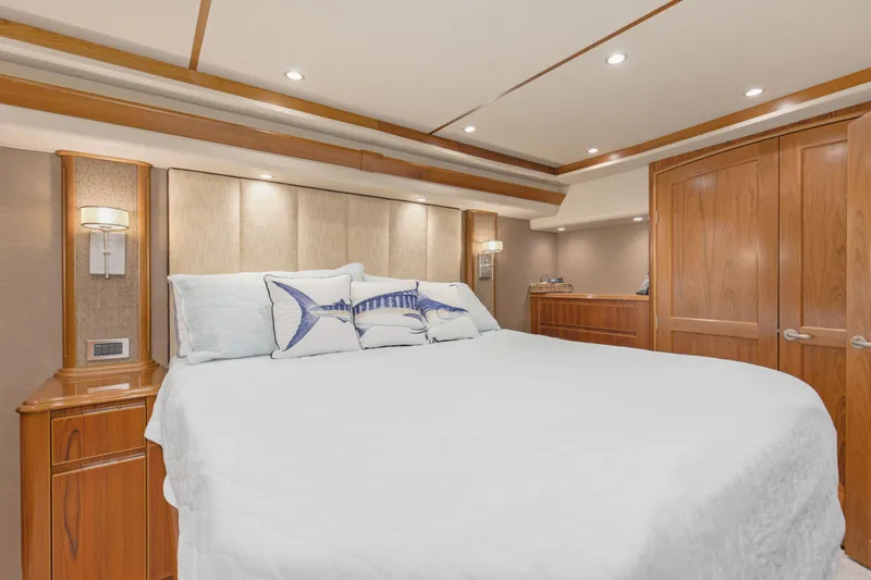 Slide: The Image of Luxurious bedroom interior of 2015 Viking 70 Convertible yacht with elegant wood finishes. - 36