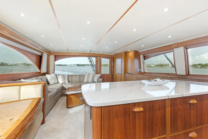 Slide: The Image of Luxurious interior of 2015 Viking 70 Convertible yacht with elegant wood finishes and panoramic windows. - 46