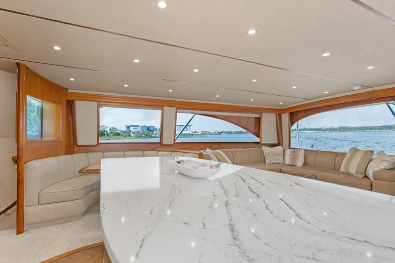 Slide: The Image of Luxurious interior of 2015 Viking 70 Convertible yacht with elegant seating and marble countertop. - 48