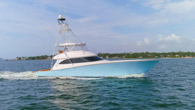 Slide: The Image of 2015 Viking 70 Convertible yacht cruising on open water. - 8