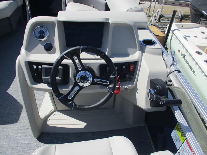Slide: The Image of 2025 Starcraft LX16R boat dashboard with steering wheel and control panel. - 6