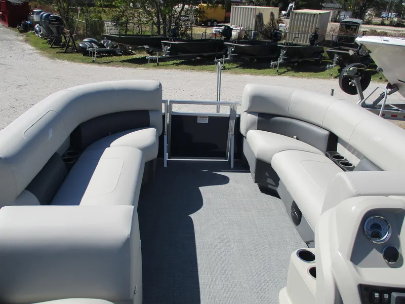 Slide: The Image of 2025 Starcraft LX16R pontoon boat interior with plush seating and modern design. - 8