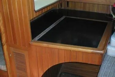 Slide: The Image of Vintage 1984 Young Sun 35 stove with wooden cover in a cozy kitchen setting. - 13